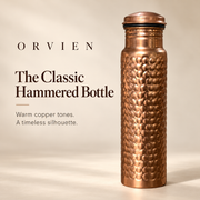 Classic copper-tone hammered bottle with a broad smooth neck and low domed cap.