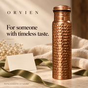 Classic hammered bottle styled with an olive ribbon and blank gift card.