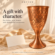 Copper pedestal goblet styled as a thoughtful gift; accessories not included.